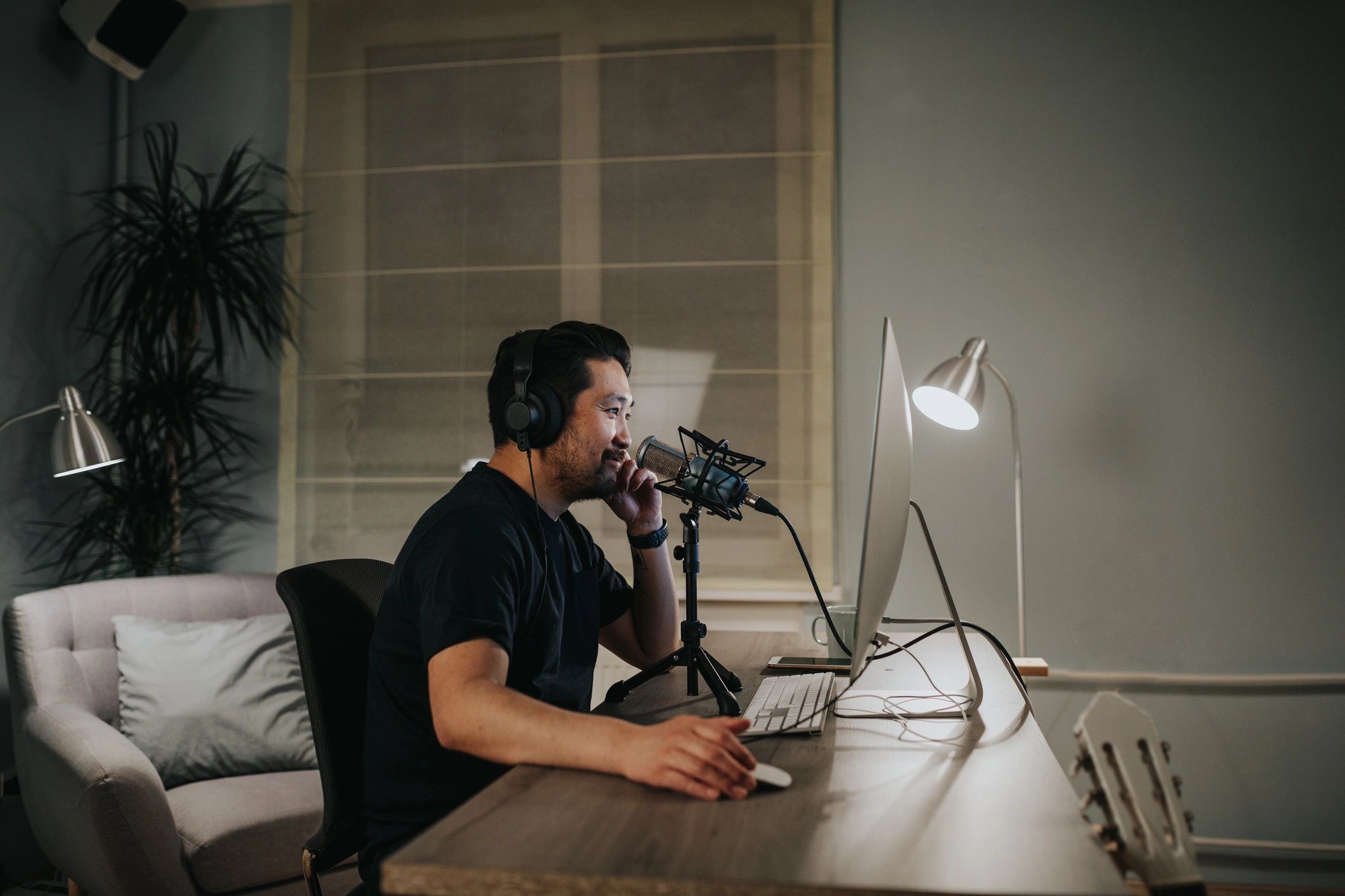 Podcaster in a home studio setup