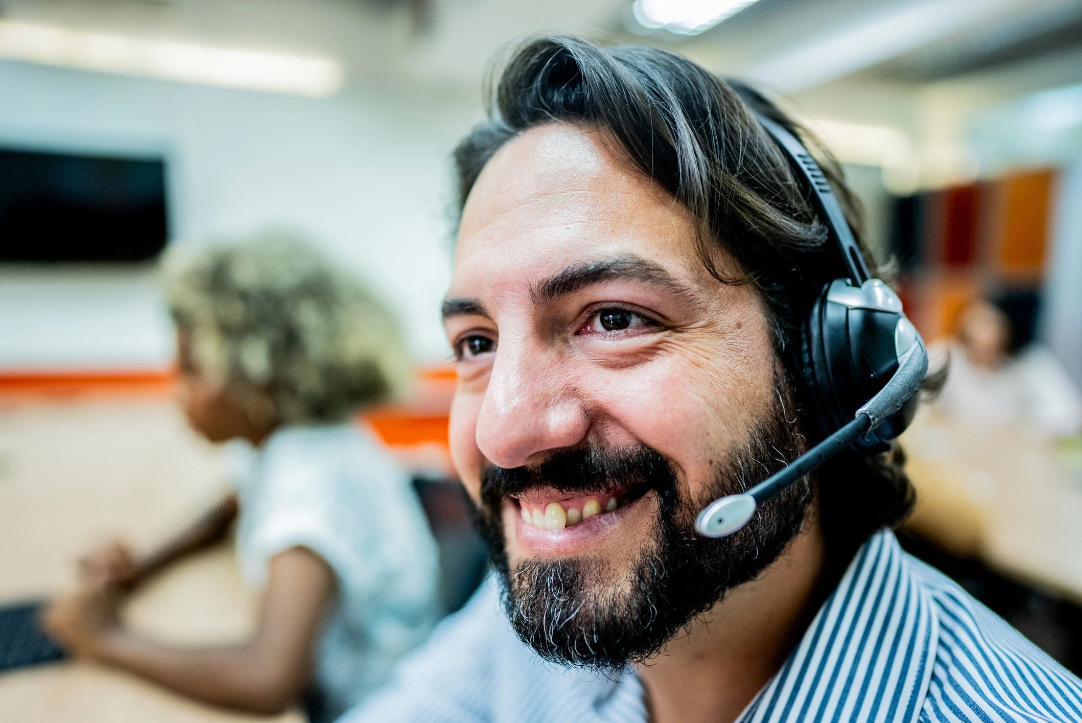 Customer support representative speaking on a headset
