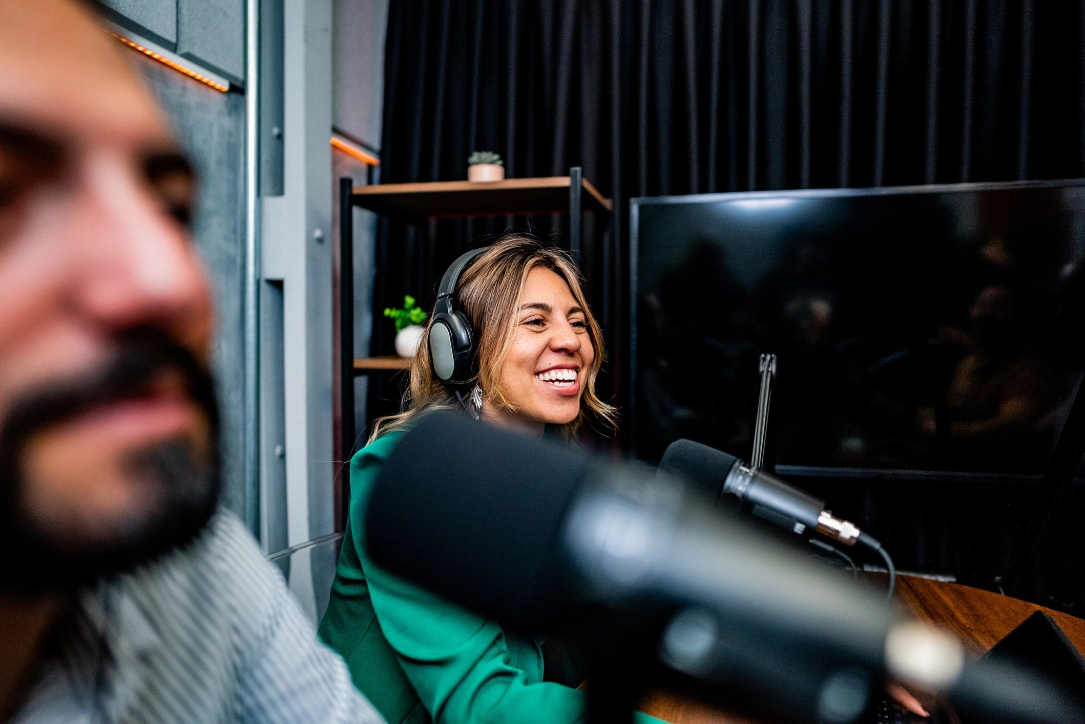 Host speaking into a studio microphone